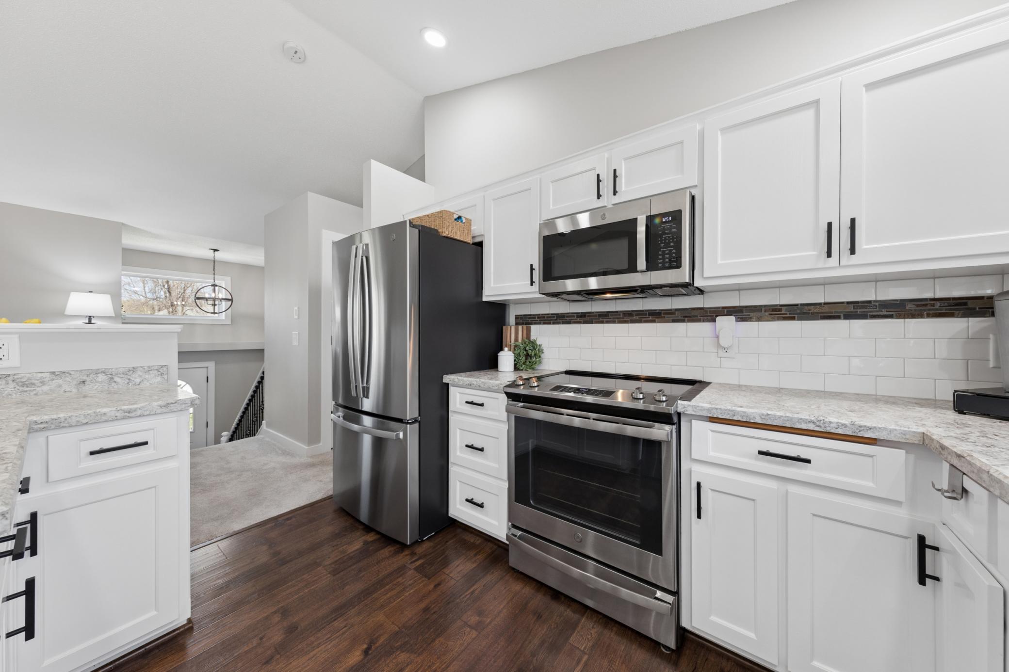 Updated stainless steel appliances make this kitchen shine.jpg