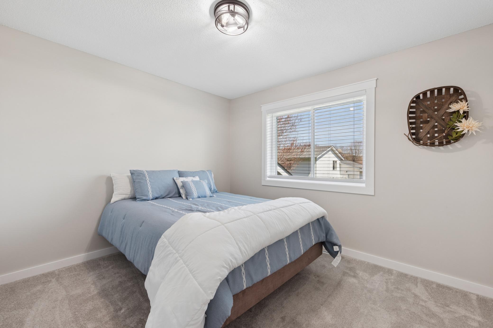 The second main level bedroom shines with light and updated paint..jpg