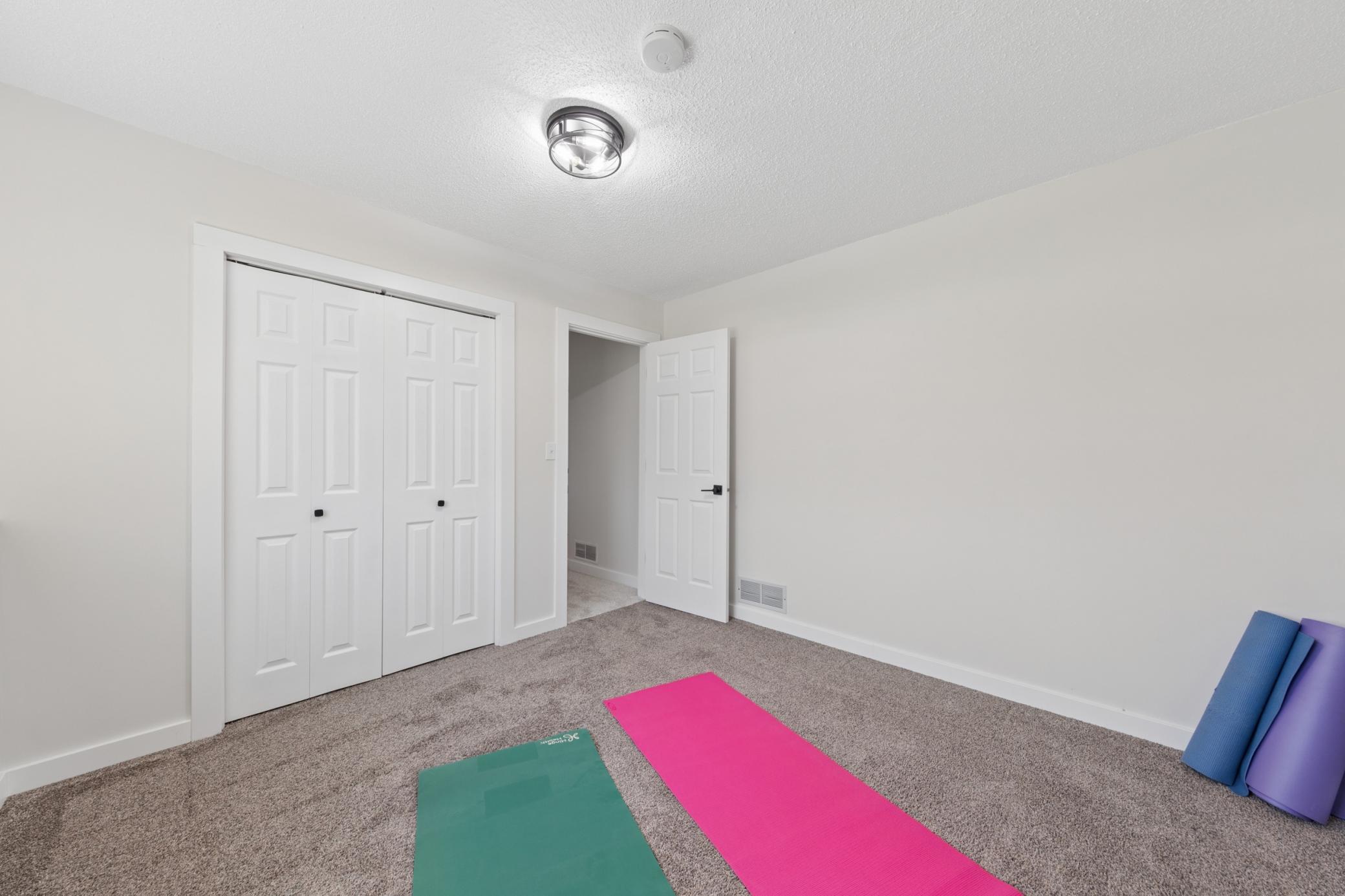 With a large closet, the third bedroom can be used as a bedroom or even a workout space..jpg