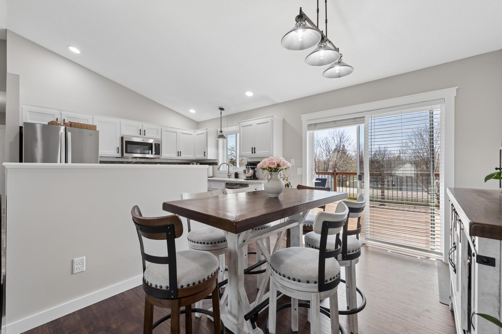 Convenience abounds whether you are cooking inside or outside with this glass door to the decki.