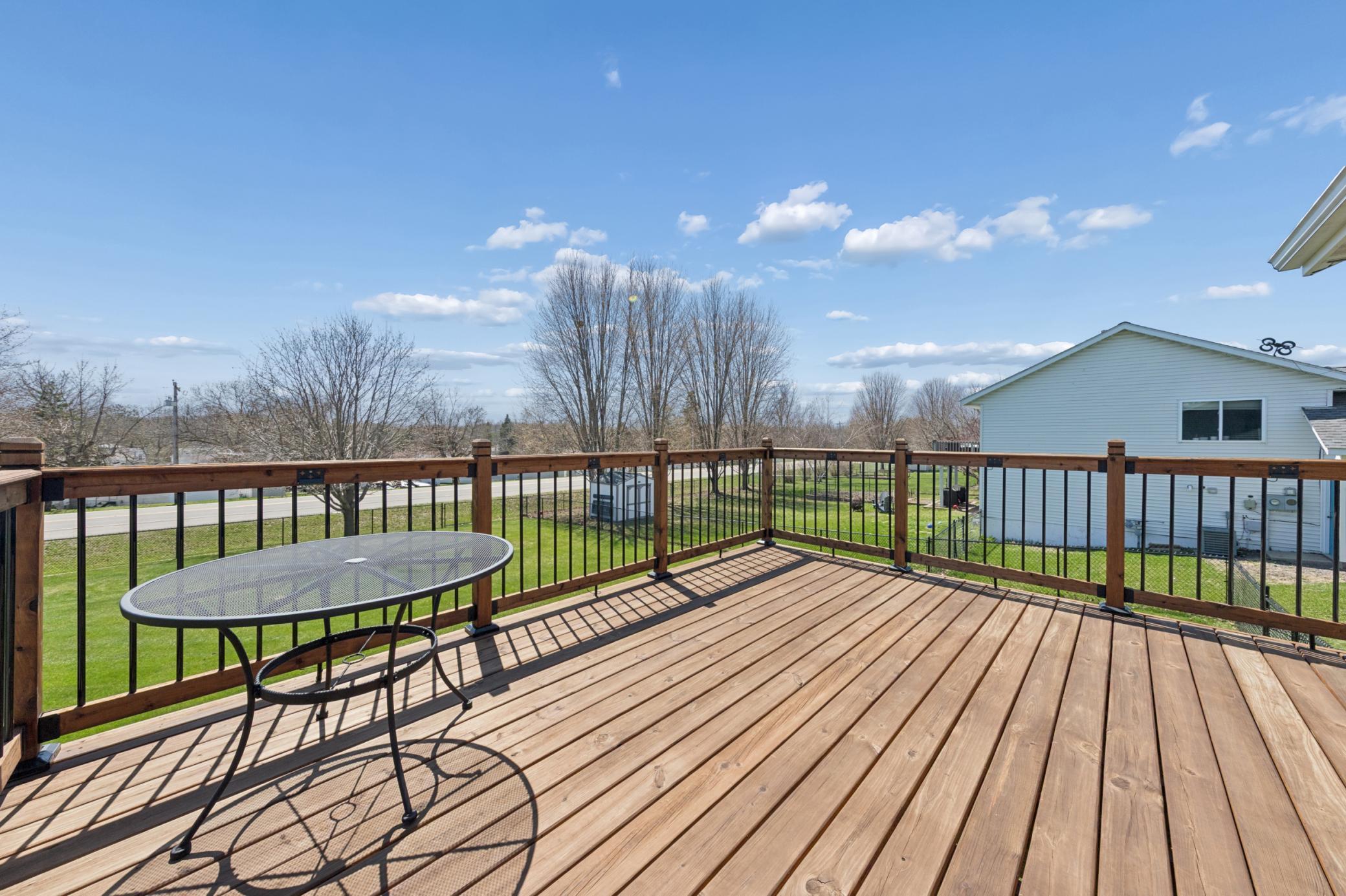 Overlooking the backyard and walking path this deck is perfect for grilling out and entertaining