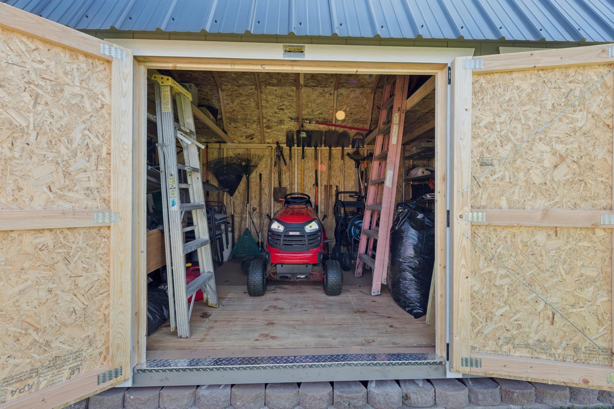 Look inside the shed and you will find tons of storage and coated flooring