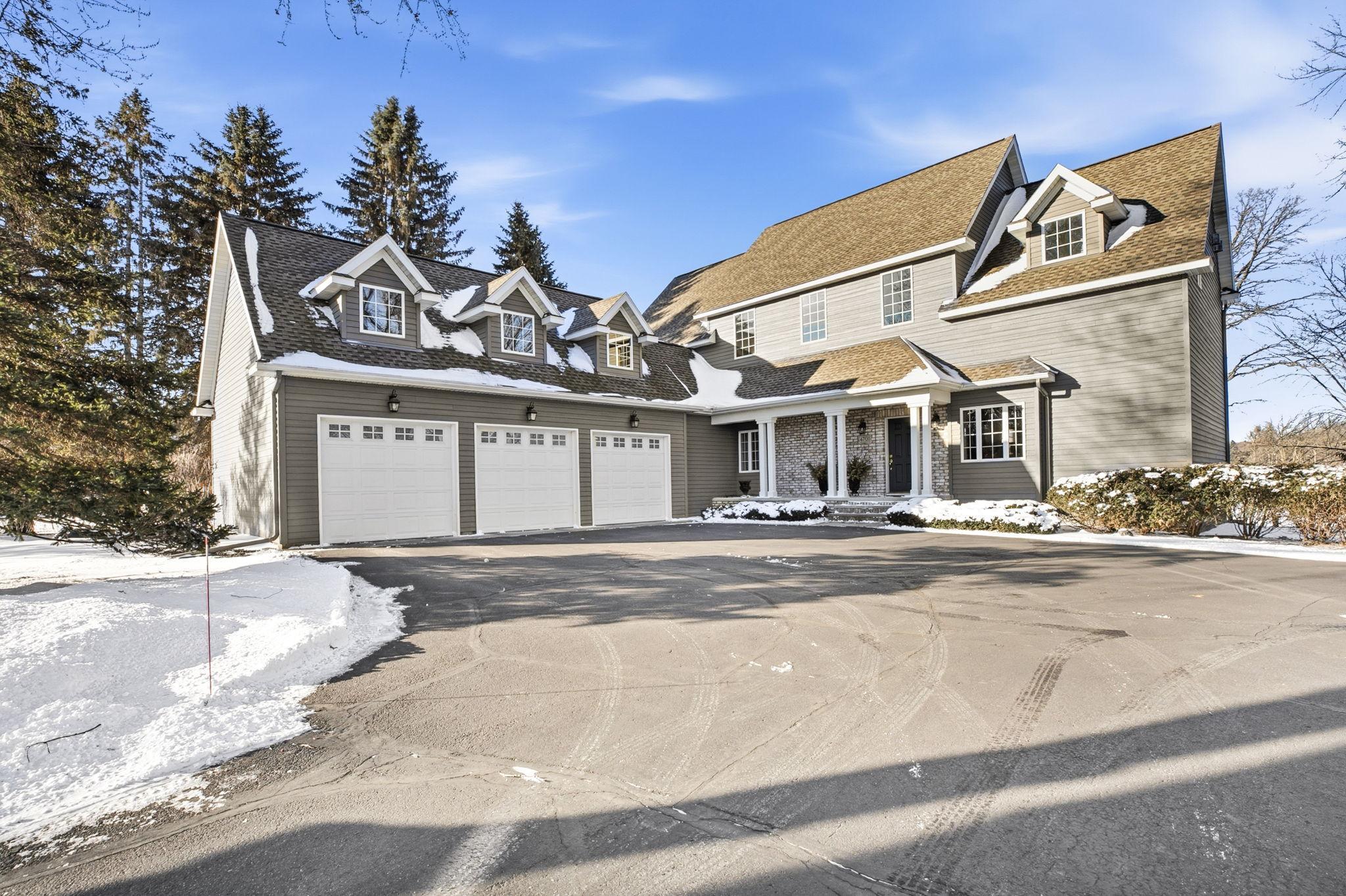 One Owner HOME Nestled On A Magnificent Wooded RIVER Lot With Panoramic Views Of The Mississippi River With Additional LOT AND OUTBUILDING!