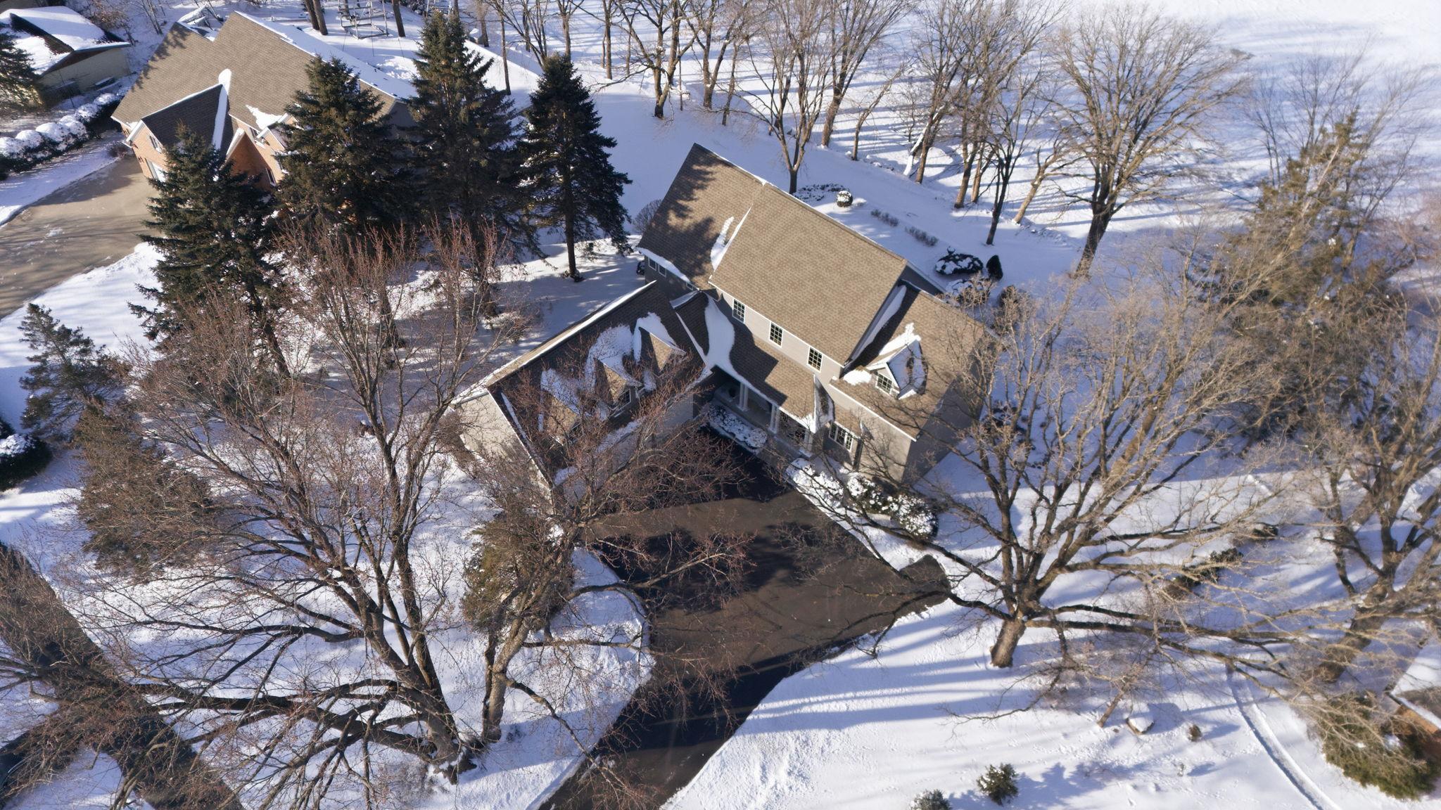 "Situated On A Picturesque, Wooded River Lot, The Property Features A Gentle, Accessible Slope Leading To The Water's Edge. The HOME Is Perfectly Positioned To Capture Sweeping, Four-Season Views Of The Mississippi River.