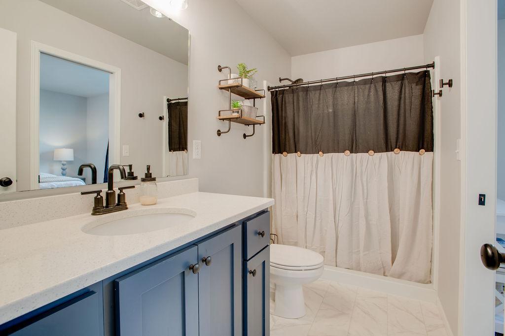 upgraded Quartz countertop & fixtures