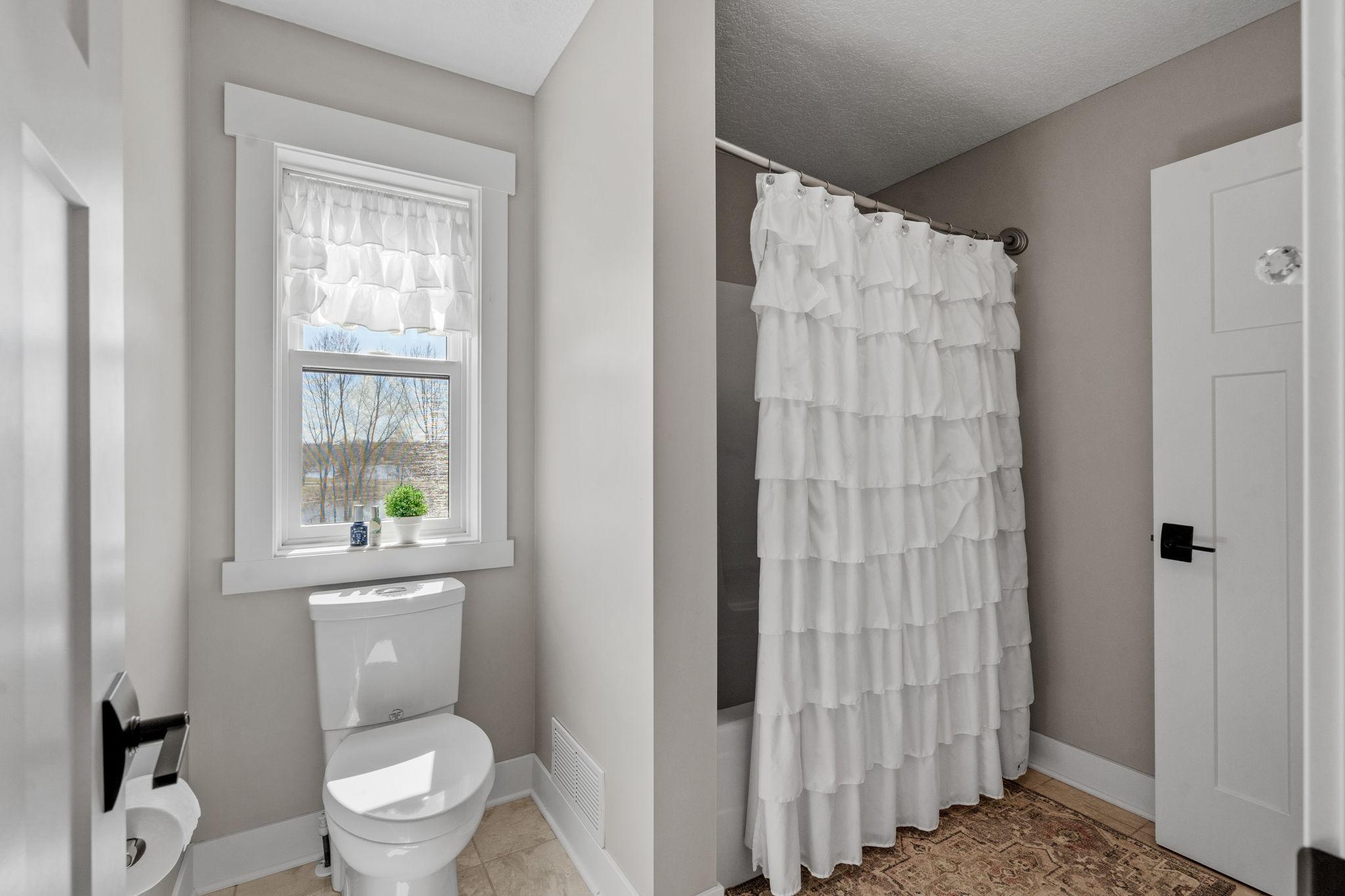 Private shower and toilet area separated from the vanities for added functionality and ease during busy mornings.