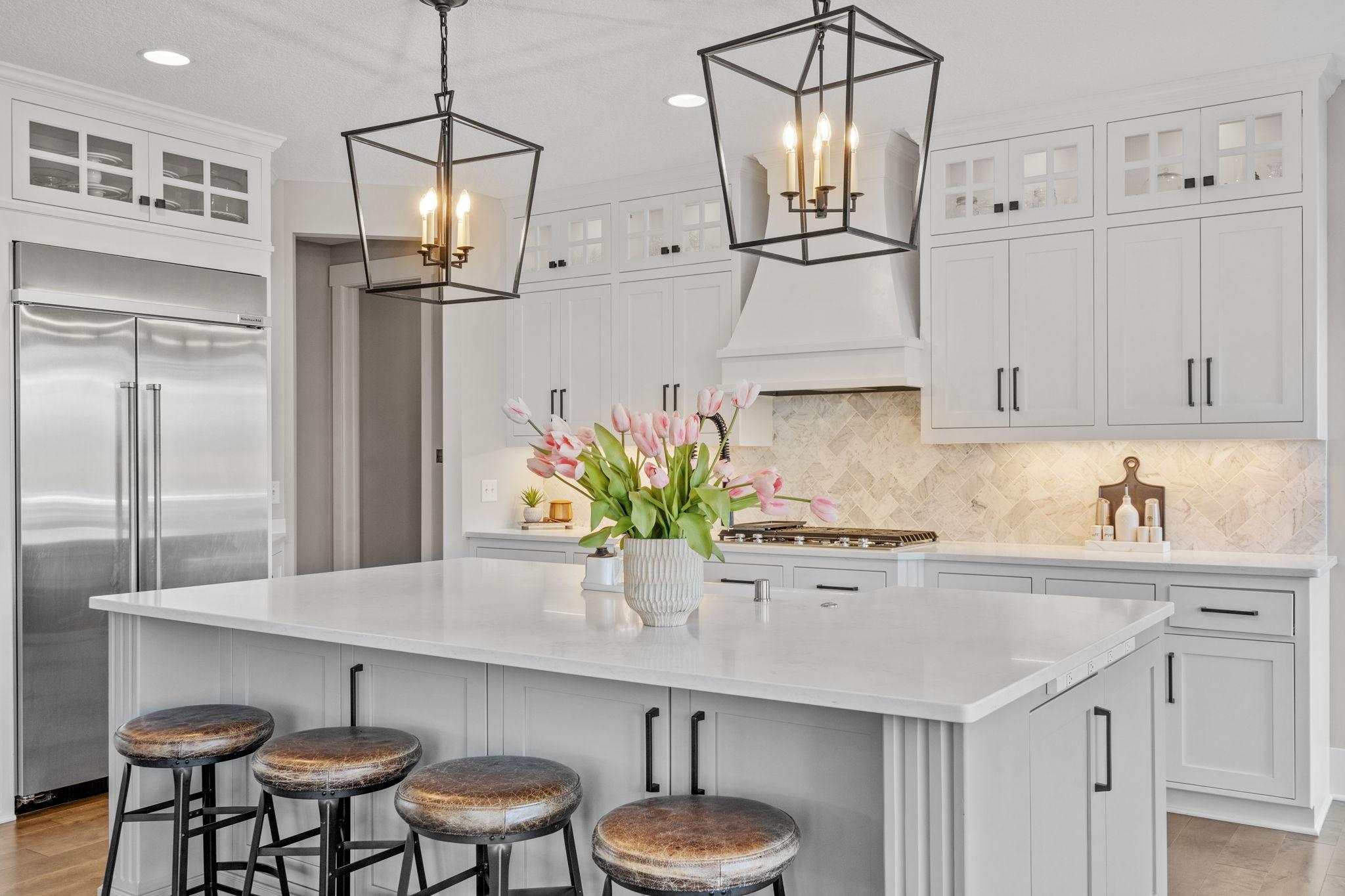 Designer pendant lighting adds warmth and elevates the overall space.