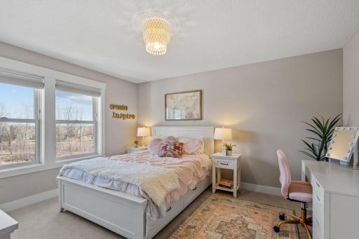 Light-filled bedroom #4 with peaceful views and a calm, comfortable atmosphere.