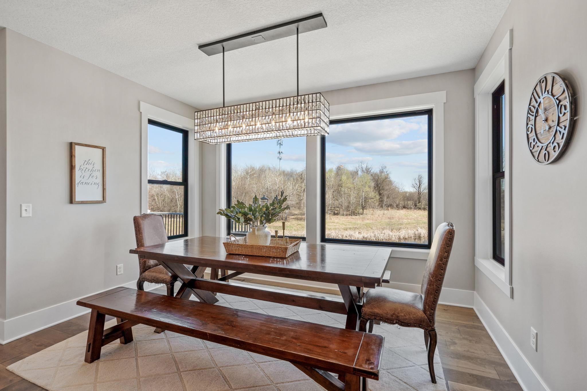 Spacious dining area easily accommodates a large table, perfect for gatherings.