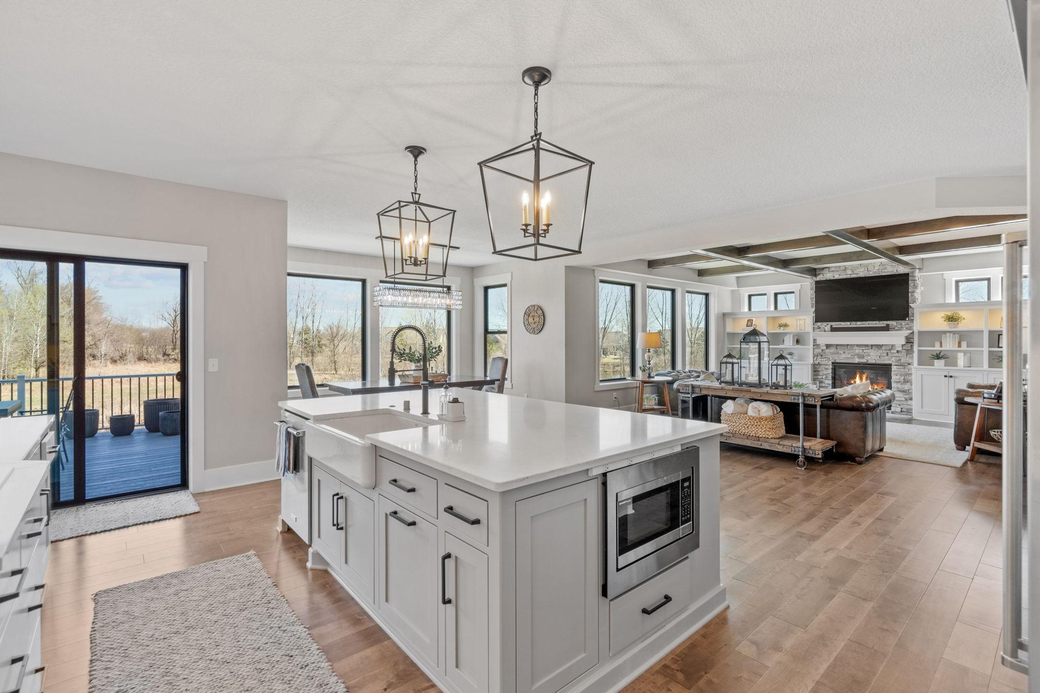 Expansive center island anchors the space, creating effortless flow between the kitchen, dining, and living areas.