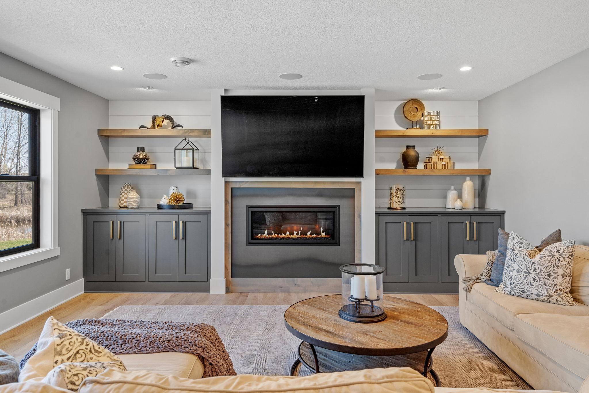 Anchored by a fireplace and surrounded by custom built-ins, this family room creates a comfortable space to gather and slow down.