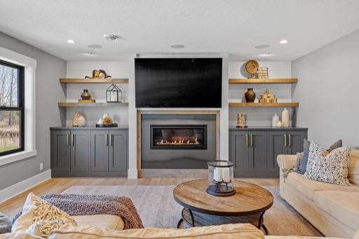Anchored by a fireplace and surrounded by custom built-ins, this family room creates a comfortable space to gather and slow down.