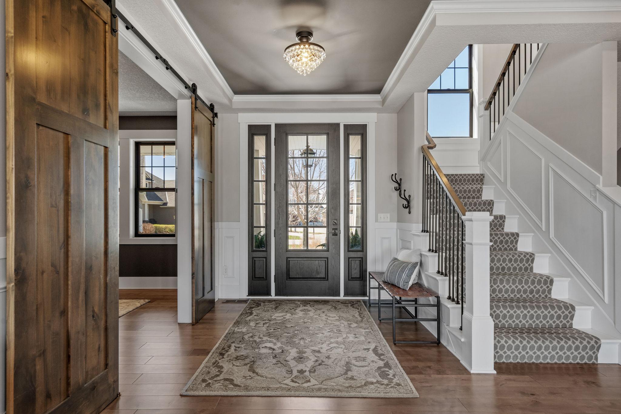 A welcoming foyer sets the tone with a bright, open feel and a refined first impression that flows seamlessly into the main living spaces.