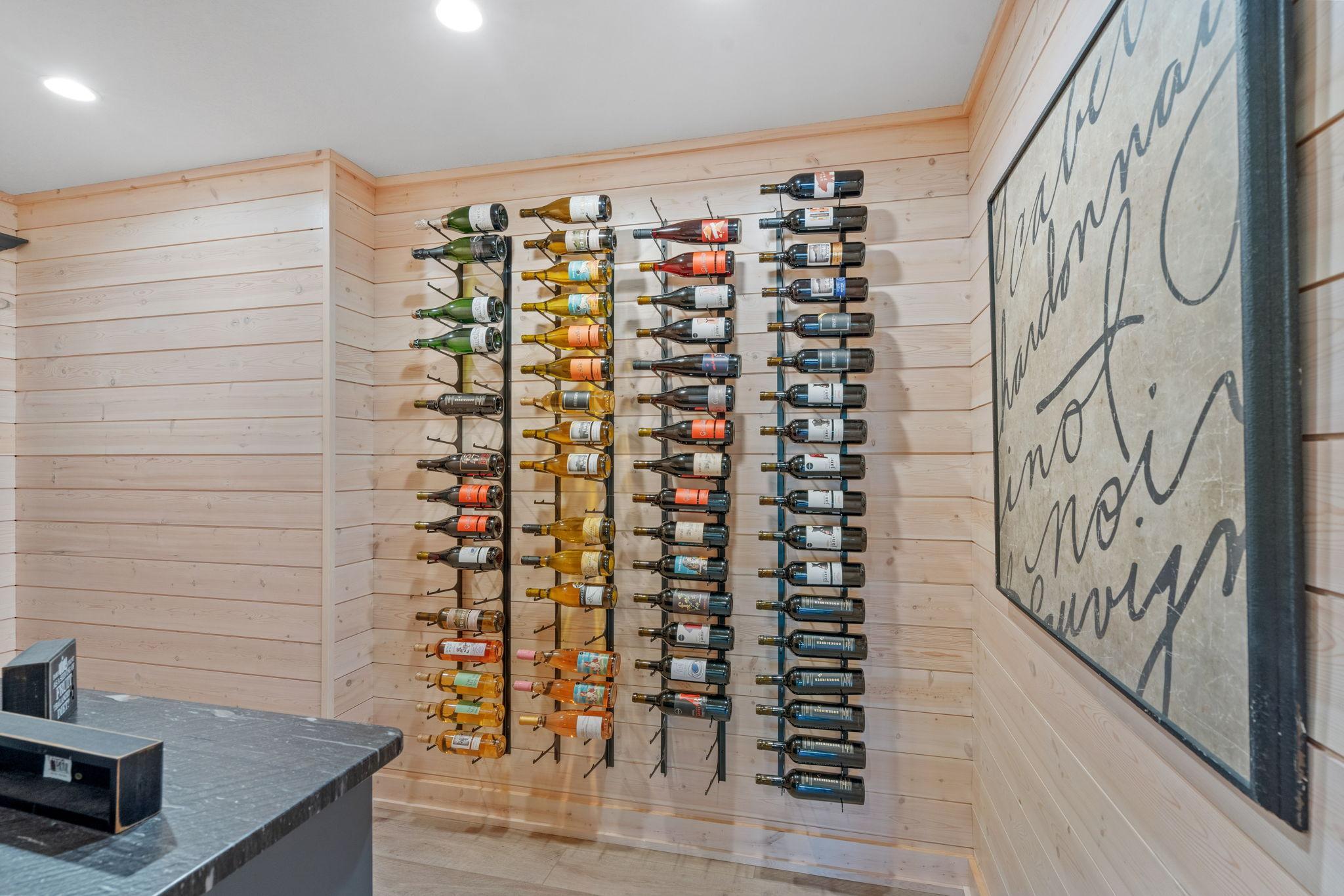 A true wine lover’s retreat. Custom wall-mounted racks showcase your collection while keeping everything beautifully organized and within reach.