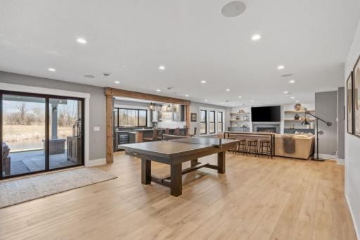 This lower level was made for gathering. Spacious family room, cozy fireplace, and a full game area that keeps everyone entertained.