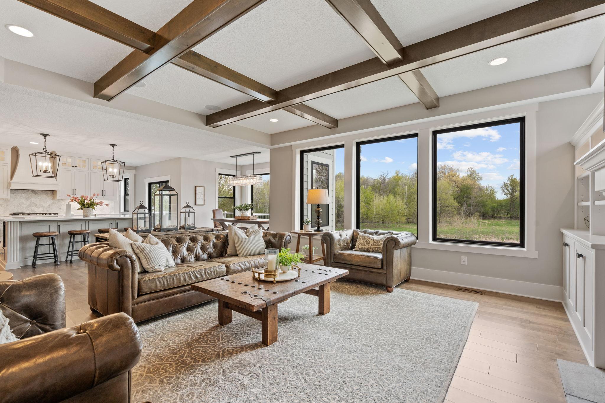 Walls of windows bring in incredible natural light and showcase peaceful, private views.