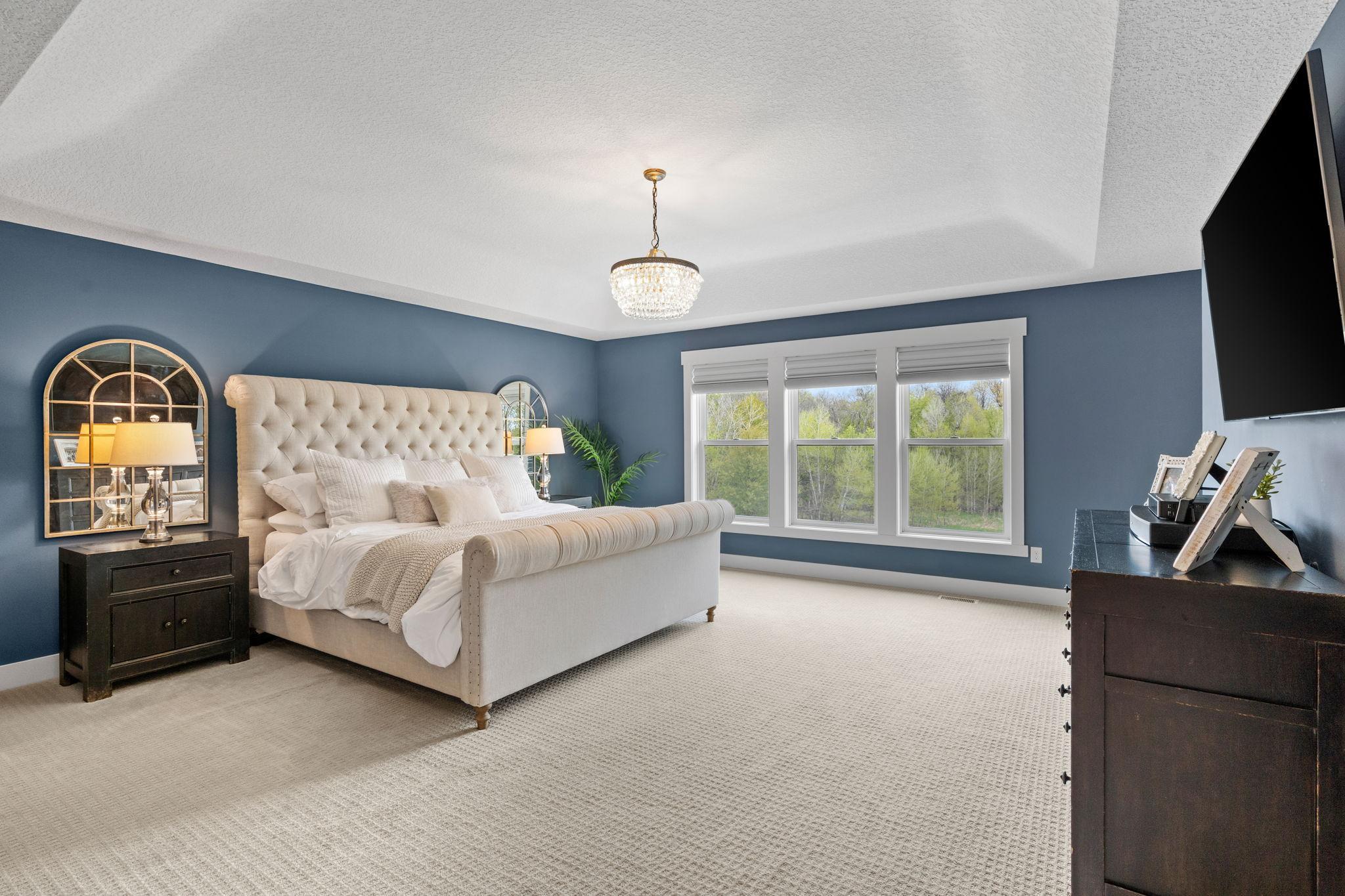 Tray ceiling, statement lighting, and room to truly unwind.