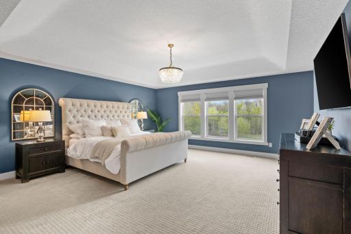 Tray ceiling, statement lighting, and room to truly unwind.