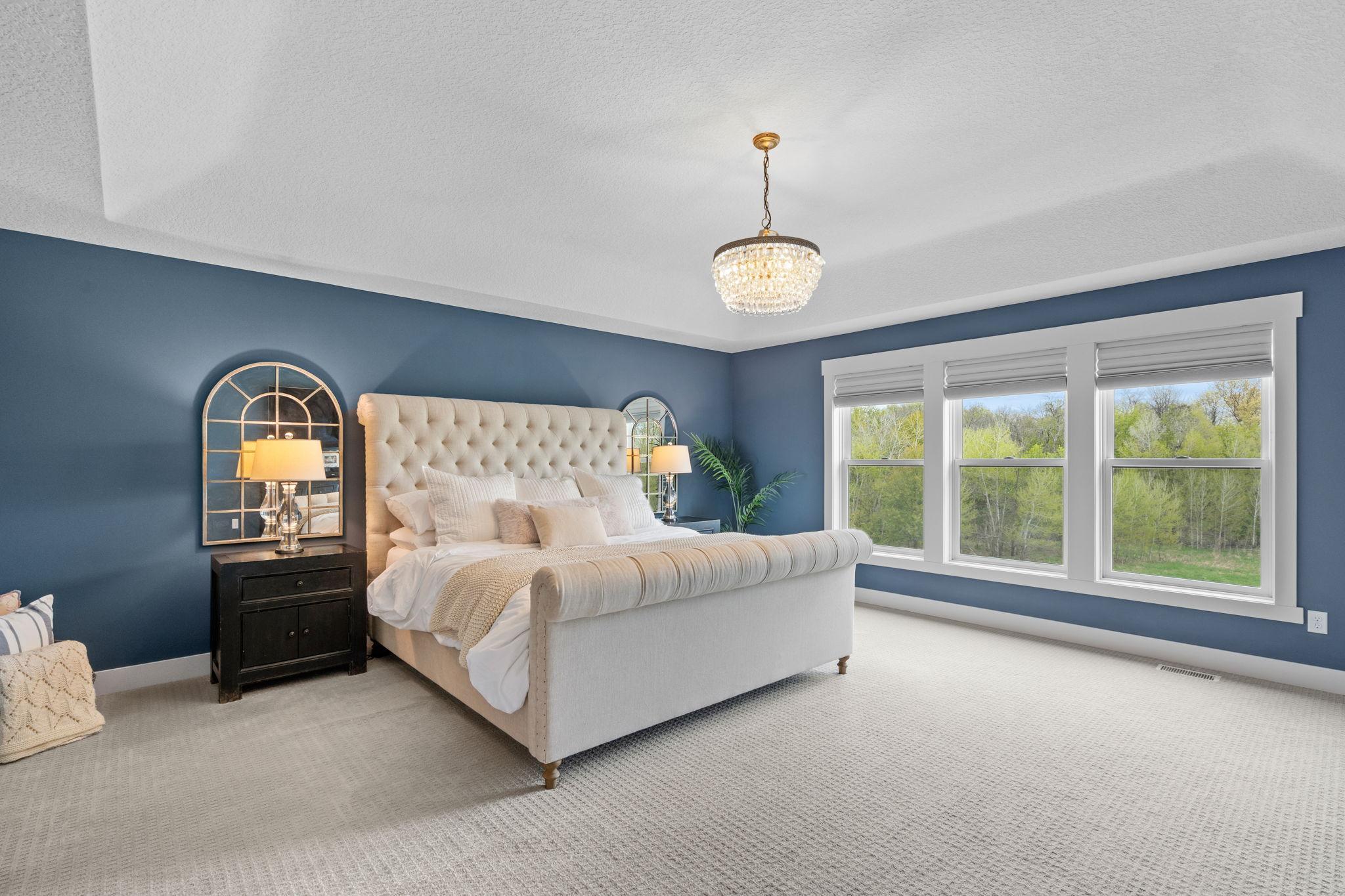 Gorgeous primary bedroom with elegant finishes and a calm, inviting feel.