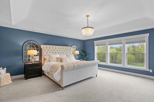 Gorgeous primary bedroom with elegant finishes and a calm, inviting feel.