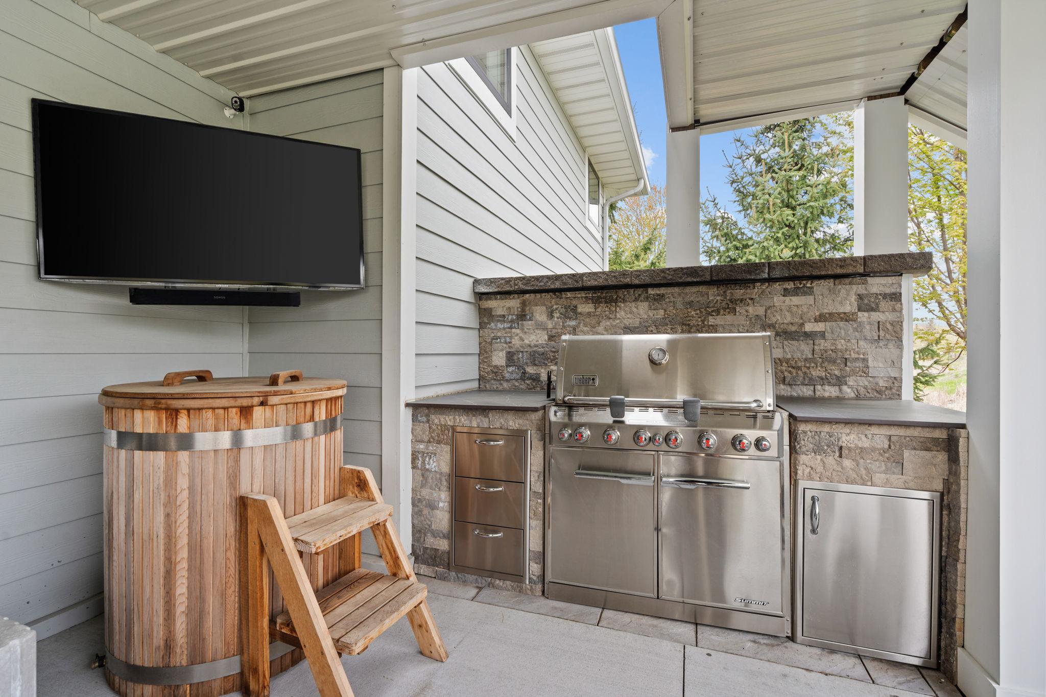 Imagine grilling dinner here while the game plays in the background and friends relax nearby.