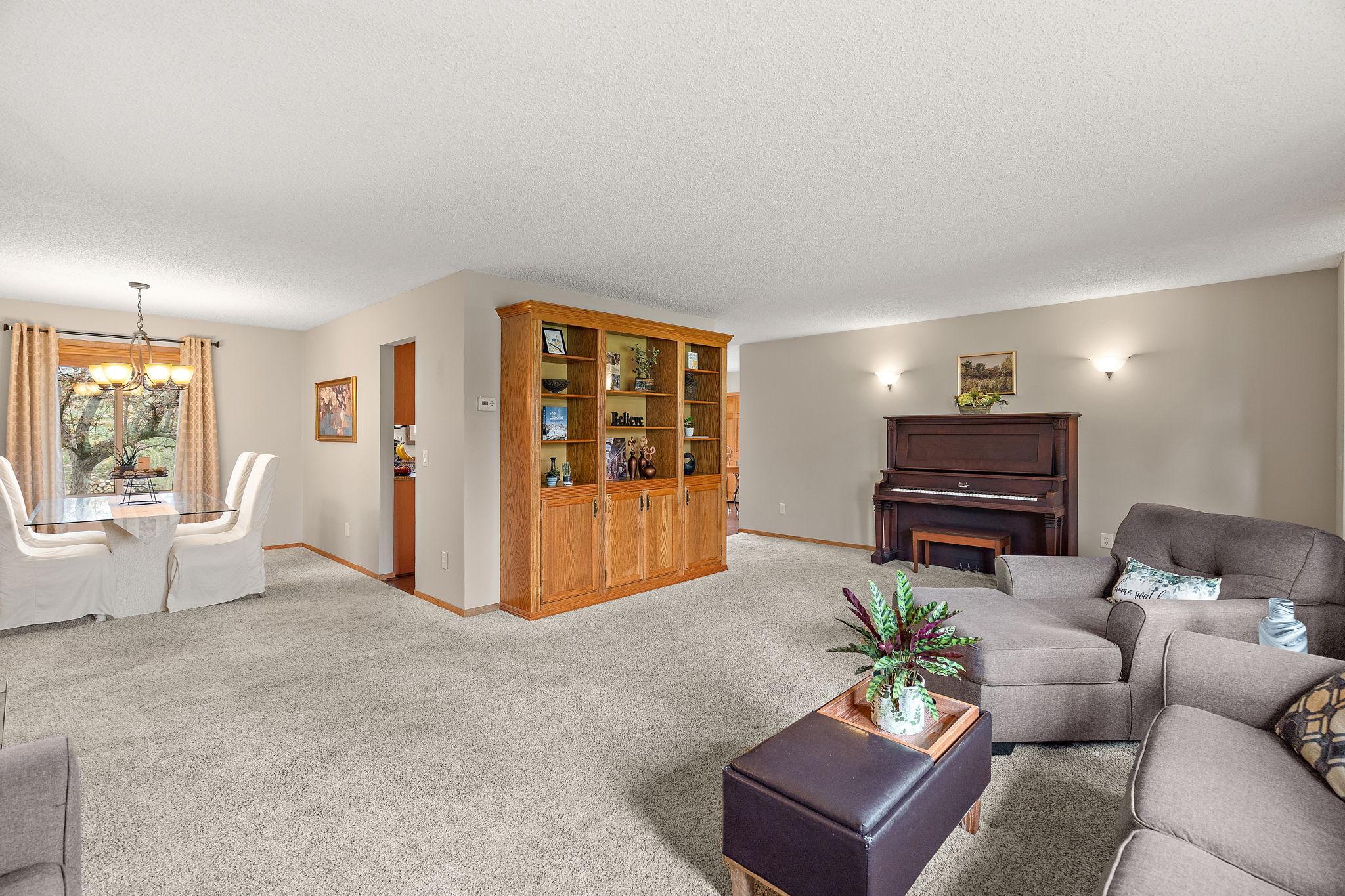 The living room flows into the formal dining room.