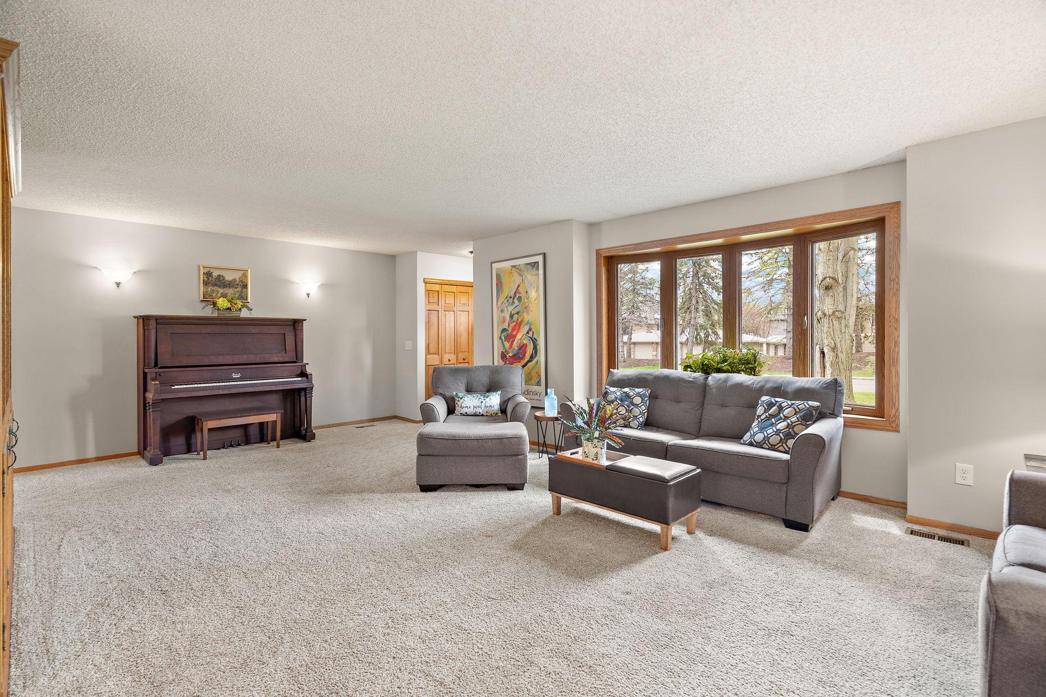 A view of the living room from the bottom of the upper and lower level staircase.