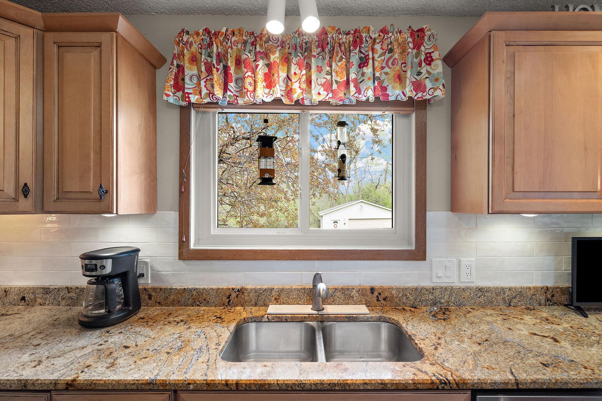 The kitchen has a window view of the backyard which also brightens up the space with natural light.