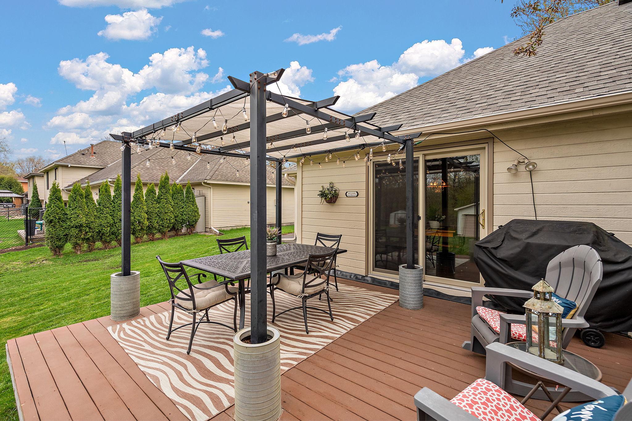 The deck is located right off from the dining area/kitchen through the patio door and is a wonderful space for enjoying a BBQ with family and friends.