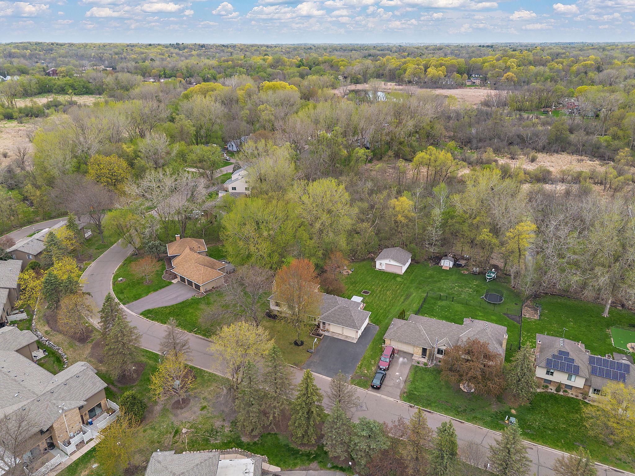 Another aerial view of the property and surrounding neighborhood.