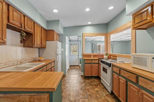 Abundant cabinet storage, recessed lighting, and a layout designed for feeding hungry lake people, this kitchen handles Saturday morning pancakes for a crowd and Friday fish fry with equal ease.