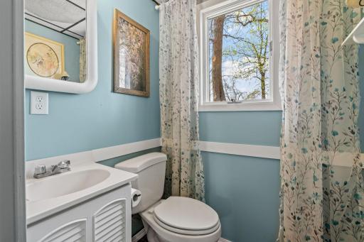 Fresh blue walls and a sunlit window make even the morning routine feel like a breath of lake air. Clean, bright, and cheerful, exactly the energy you want to start a lake day.