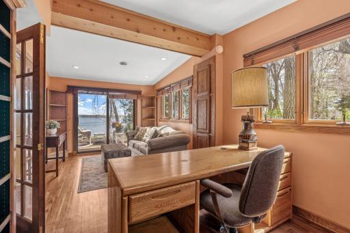 Rich hardwood floors, built-in shelving, and natural light through the trees, this flex space works as a private office, a reading room, a quiet morning retreat, or whatever your lake life needs it to be.