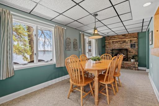 Gather everyone around this table. There's room for the whole crew, the fireplace is already lit, and Lake Francis is right there through the glass. This is the room where lake weekends slow down and conversations stretch long past dessert.