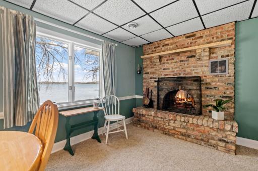 Fire crackling on one side, Lake Francis glittering through the window on the other. This corner of the dining room captures the two best things about this property in a single view.