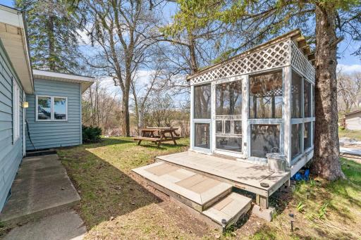 Nestled between mature pines just feet from the water, this screened lakeside porch feels like the best-kept secret on Lake Francis. The lake is right there, close enough to hear it, beautiful enough to stare at for hours.