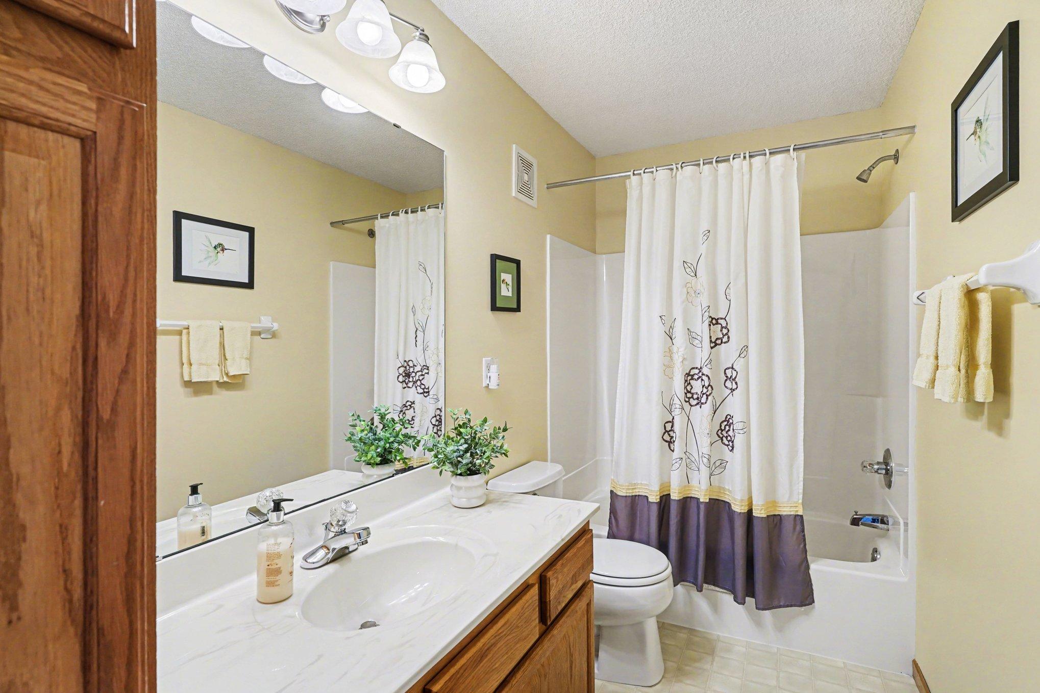 The full hall bath has a linen closet.