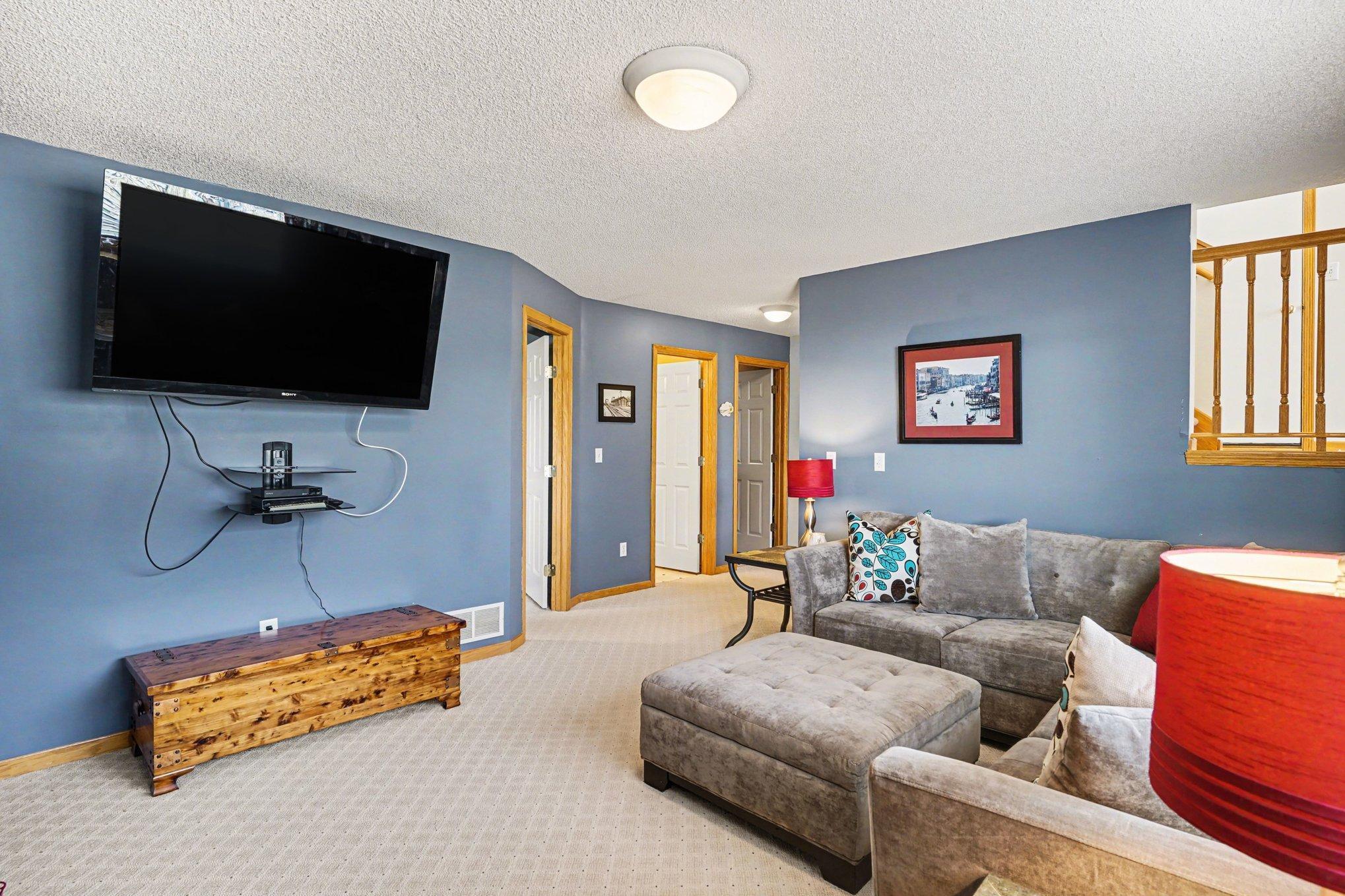 View from the family room with views of the 3rd bedroom, 3/4 bath and laundry/storage room.