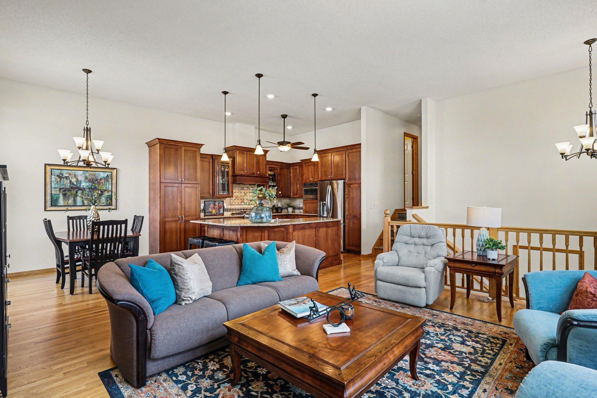 Beautiful upper level has an open-concept floorplan with hardwood floors.