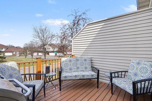 Maintenance Free deck has views of the side yard. The seller installed an electric awning in 2025.