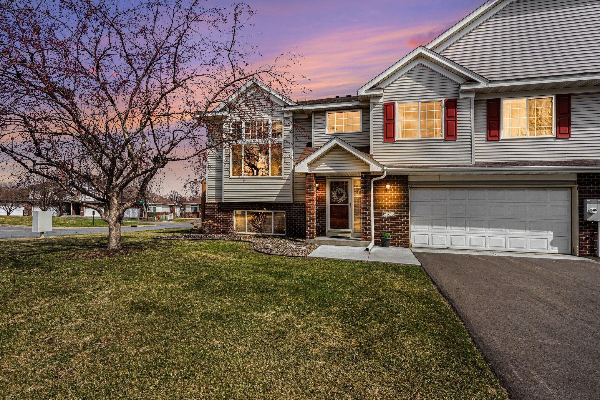 So much curb appeal with the brick accents and cement sidewalk.