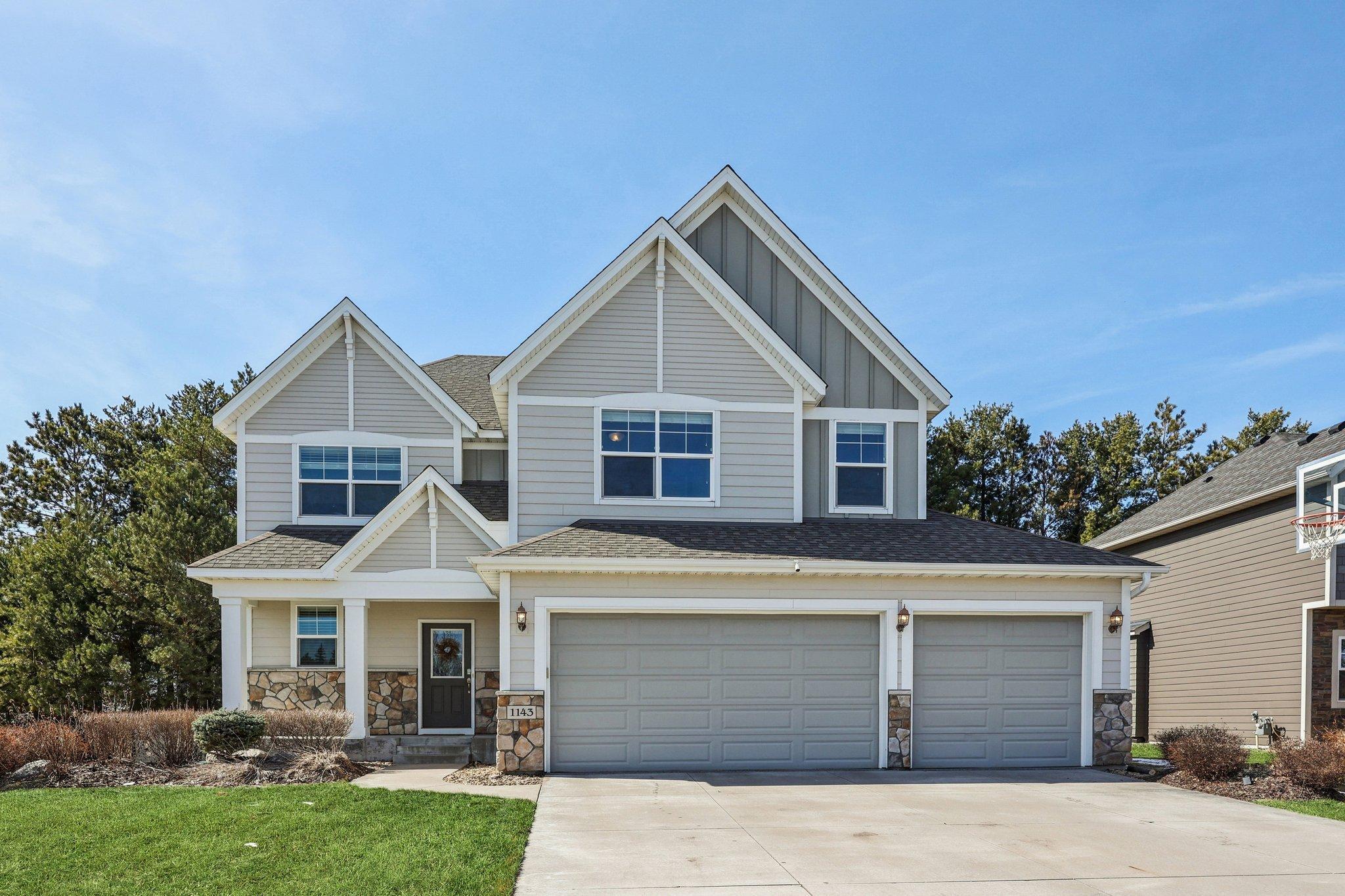 Beautiful Hanson Builders two story home with inviting front porch and spacious 3 car garage in a desirable neighborhood.