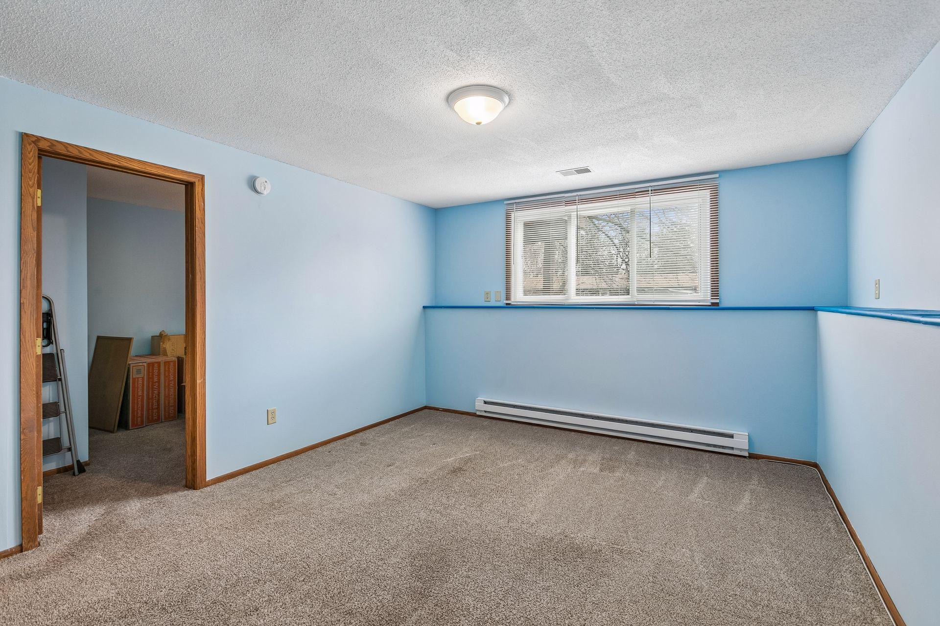 Lower level family room and door to bedroom
