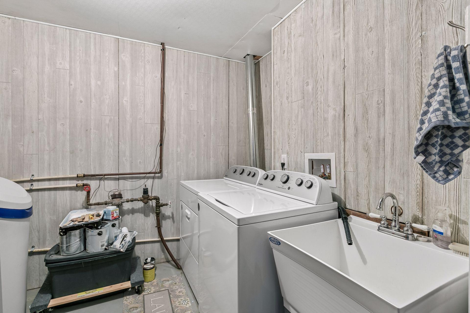 Laundry room newly paneled and Water softener replaced in 2021