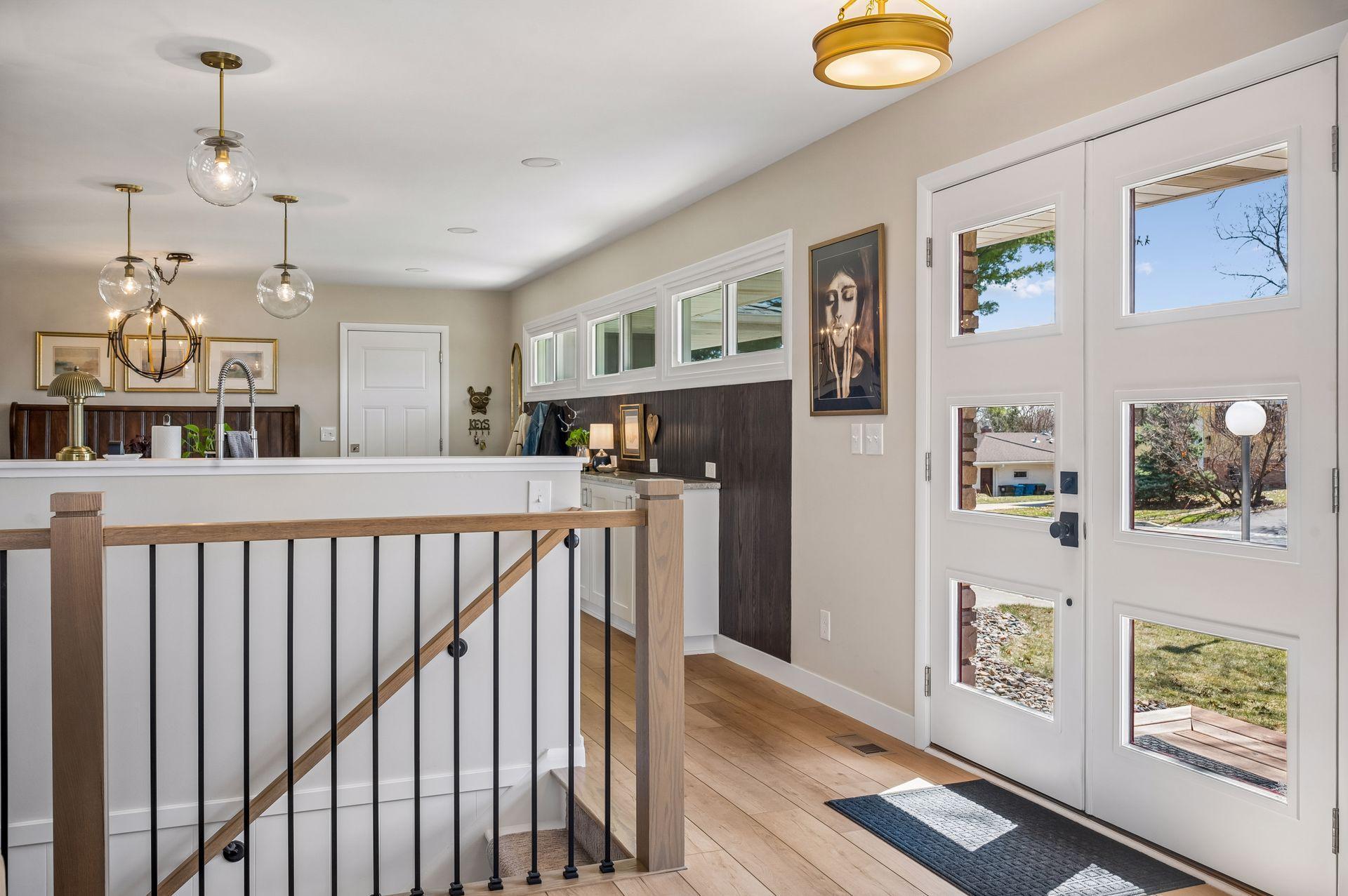 Entryway flows to kitchen and living room