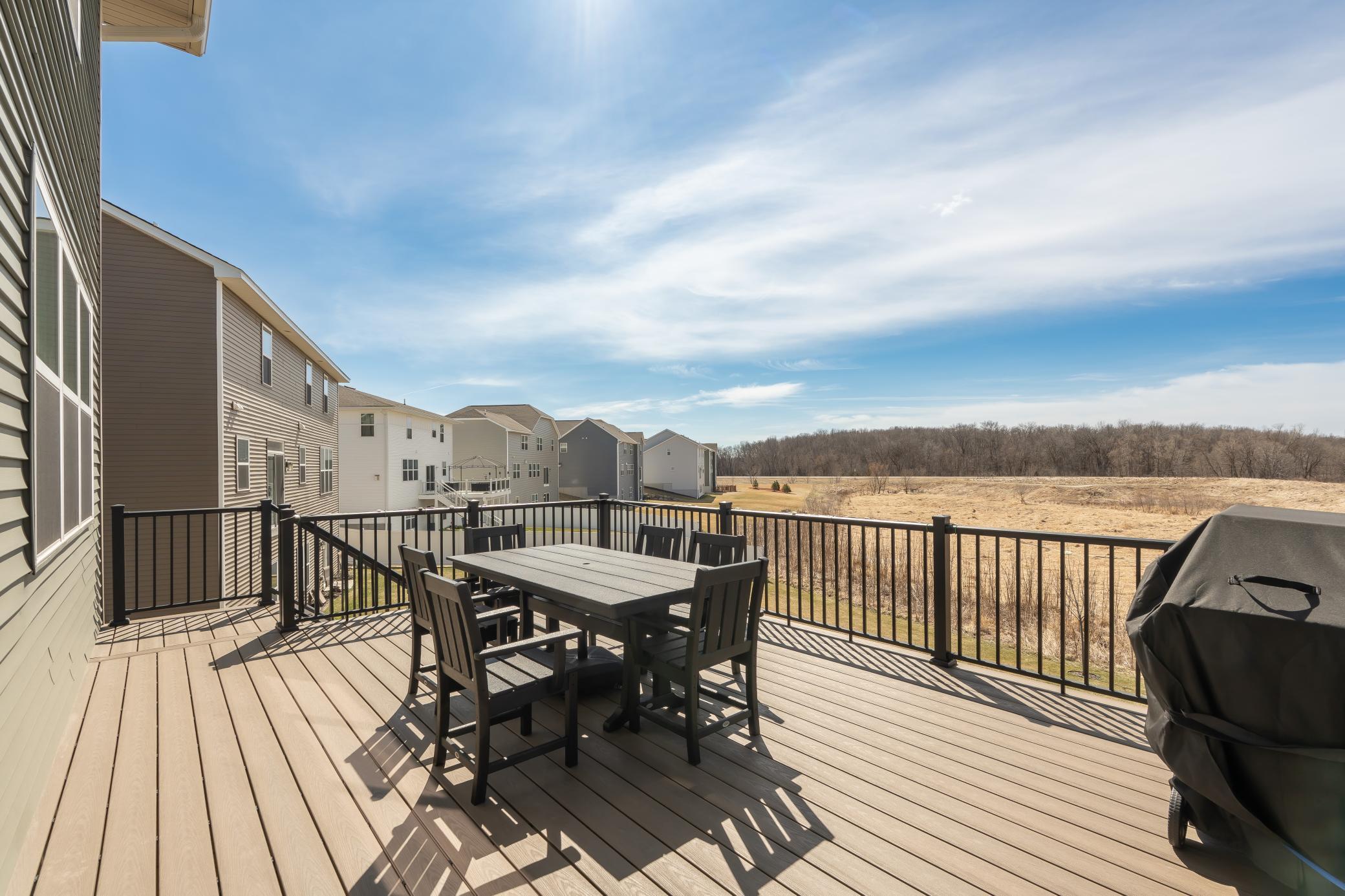 Spacious maintenance-free deck with peaceful views and no backyard neighbors!