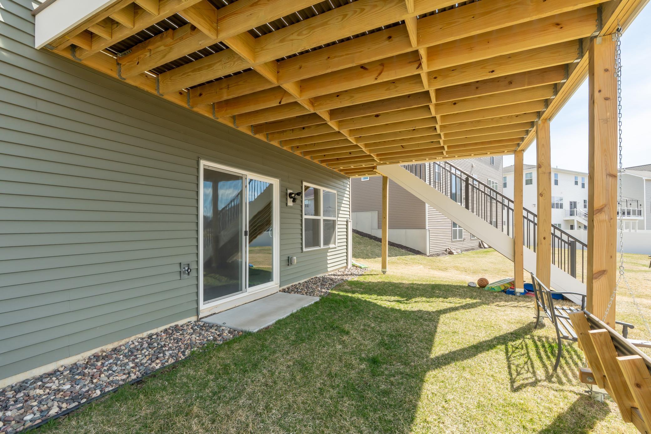 Covered lower-level patio with walkout access