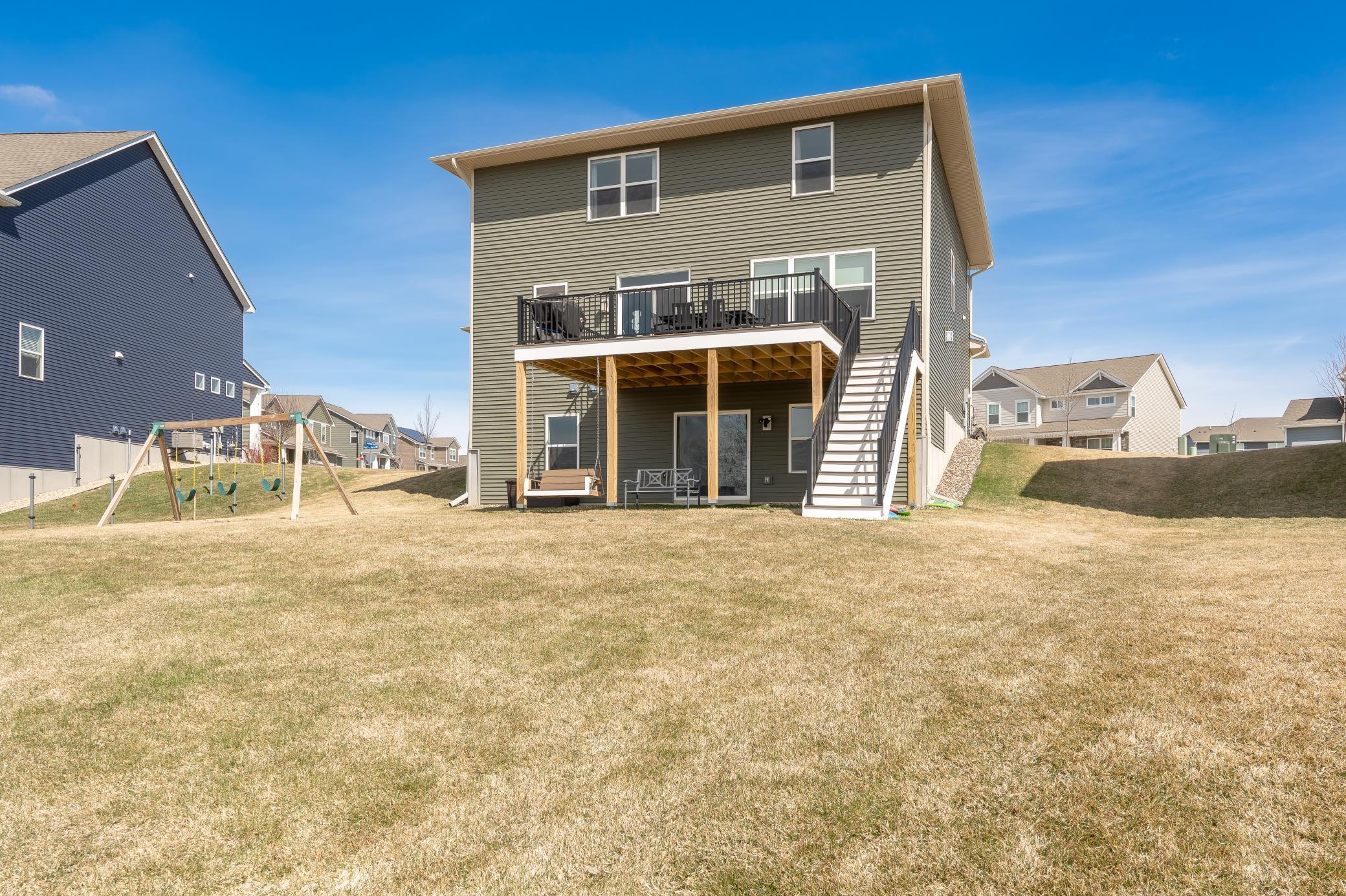 Enjoy a spacious backyard with room to roam for summer nights and outdoor fun