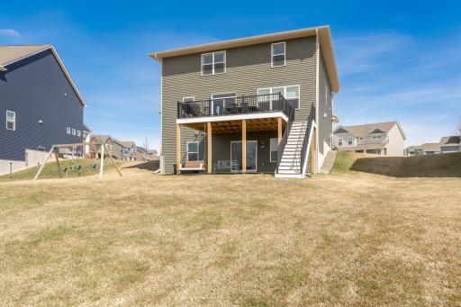 Enjoy a spacious backyard with room to roam for summer nights and outdoor fun