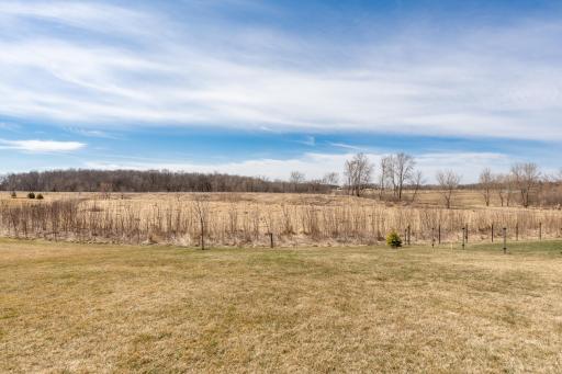Enjoy quiet wetland views and no backyard neighborsânothing but open space behind you